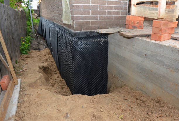 SJ Waterproofing Pros technician performing targeted Sump Pump Installation assessment in Highland Park, IL